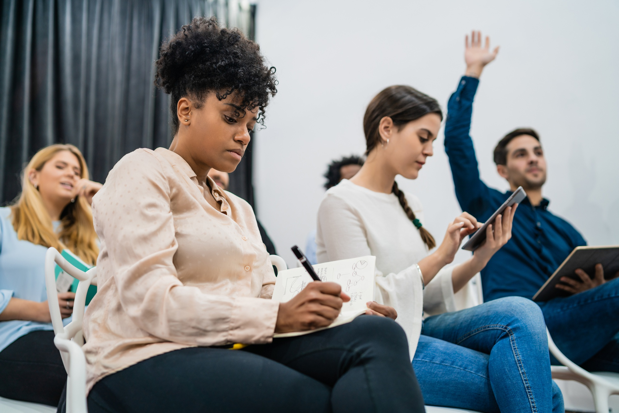 Professionals communicating and networking at a premium community conference